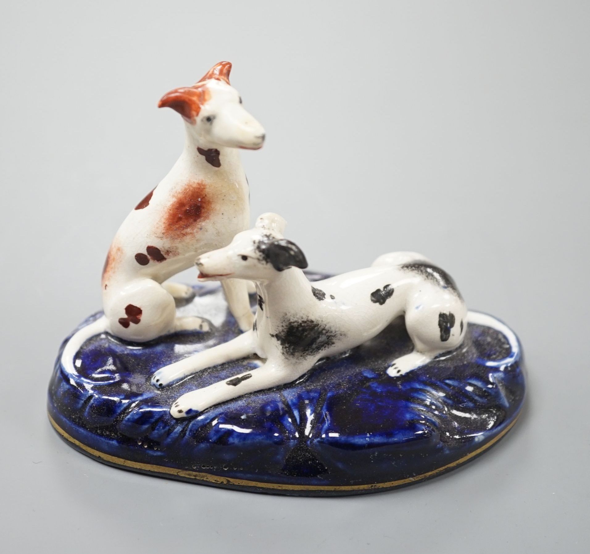 A Staffordshire porcelain group of two greyhounds, c.1835-50, 10.5 cm long, Provenance: Dennis G.Rice collection